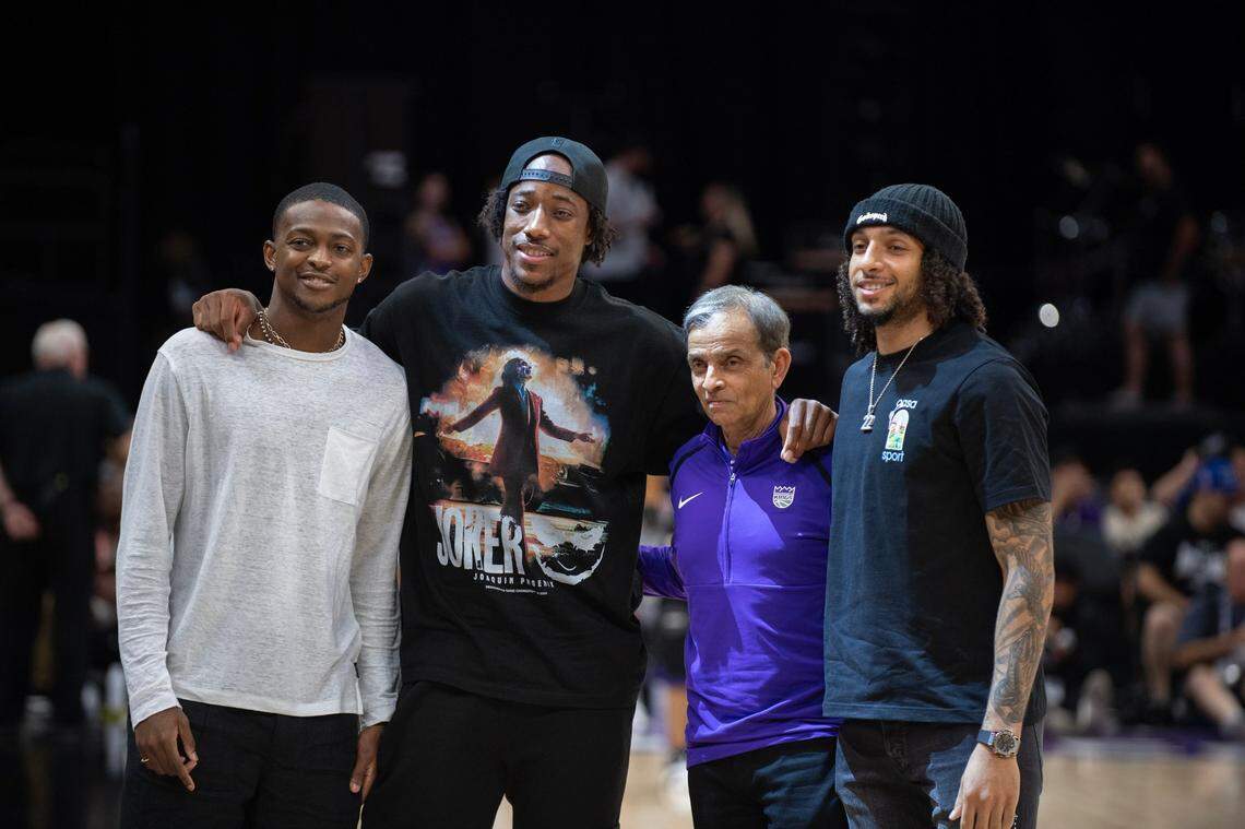 New Sacramento Kings player DeMar DeRozan stands with De’Aaron Fox, left, Kings co-owner Vivek Ranadivé, and 2024 draft pick Devin Carter, right, during the California Classic summer league contest against the Chinese men’s team on July 6 at Golden 1 Center.