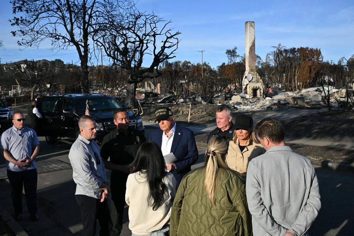 President Donald Trump and first lady Melania Trump meet residents as they tour a fire-affected area in the Pacific Palisades on Friday.