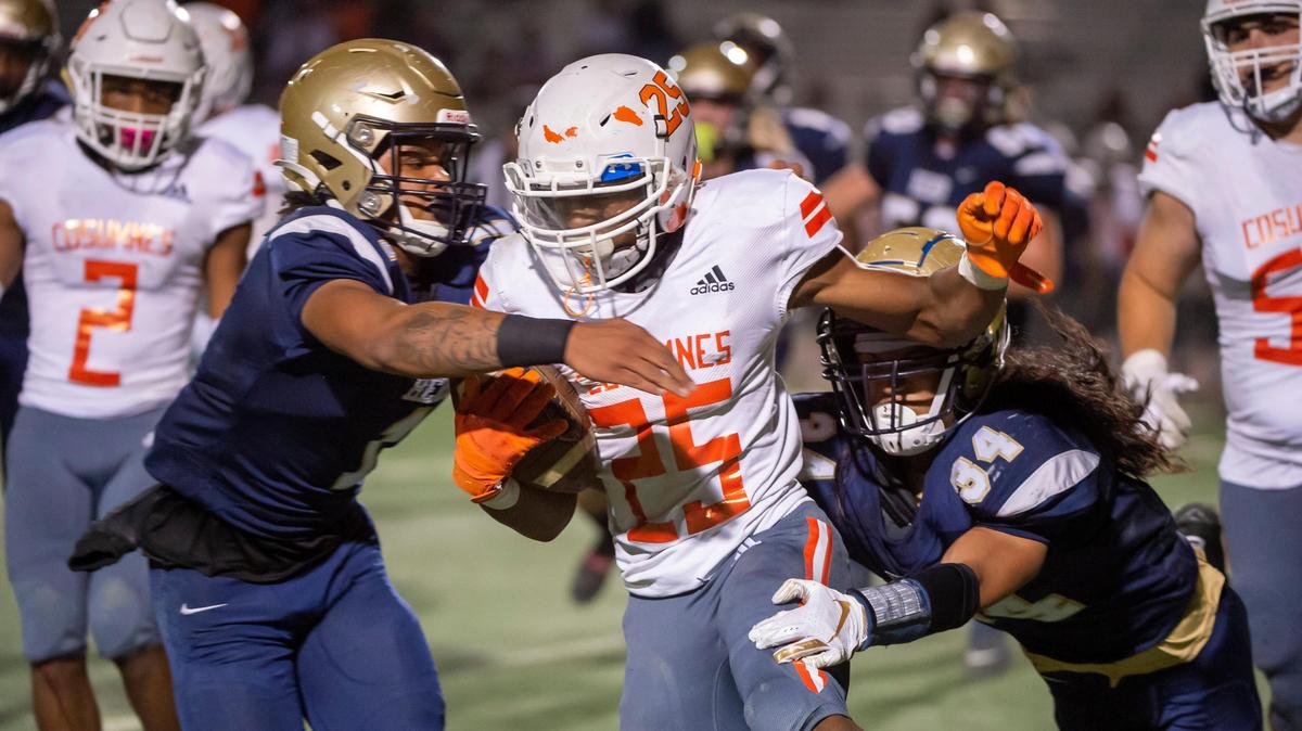 Cosumnes Oaks Wolfpack Christian Ridgway (25), runs with the ball during the first half as the Elk Grove Thundering Herd host the Cosumnes Oaks Wolfpack at Elk Grove High School, Friday, Oct. 25, 2019.