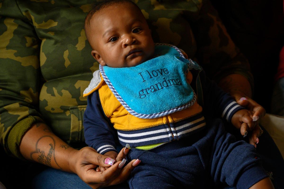 Dajha Richards’ son Kash Horton, 5-months old, is held by his grandmother Ebony Douglas on Monday, Feb. 4, 2019 in Sacramento. The toddler lost his mother to gun violence in their home Jan. 8, 2019. His father Damion Horton, 21, has been charged with the murder.