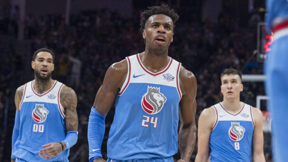 Buddy Hield, center, and Willie Cauley-Stein, left, are the highest-rated Kings on the “NBA 2K19” video game that’s scheduled to be released next week. Both have 79 ratings. Bogdan Bogdanovic, right, is a 77.