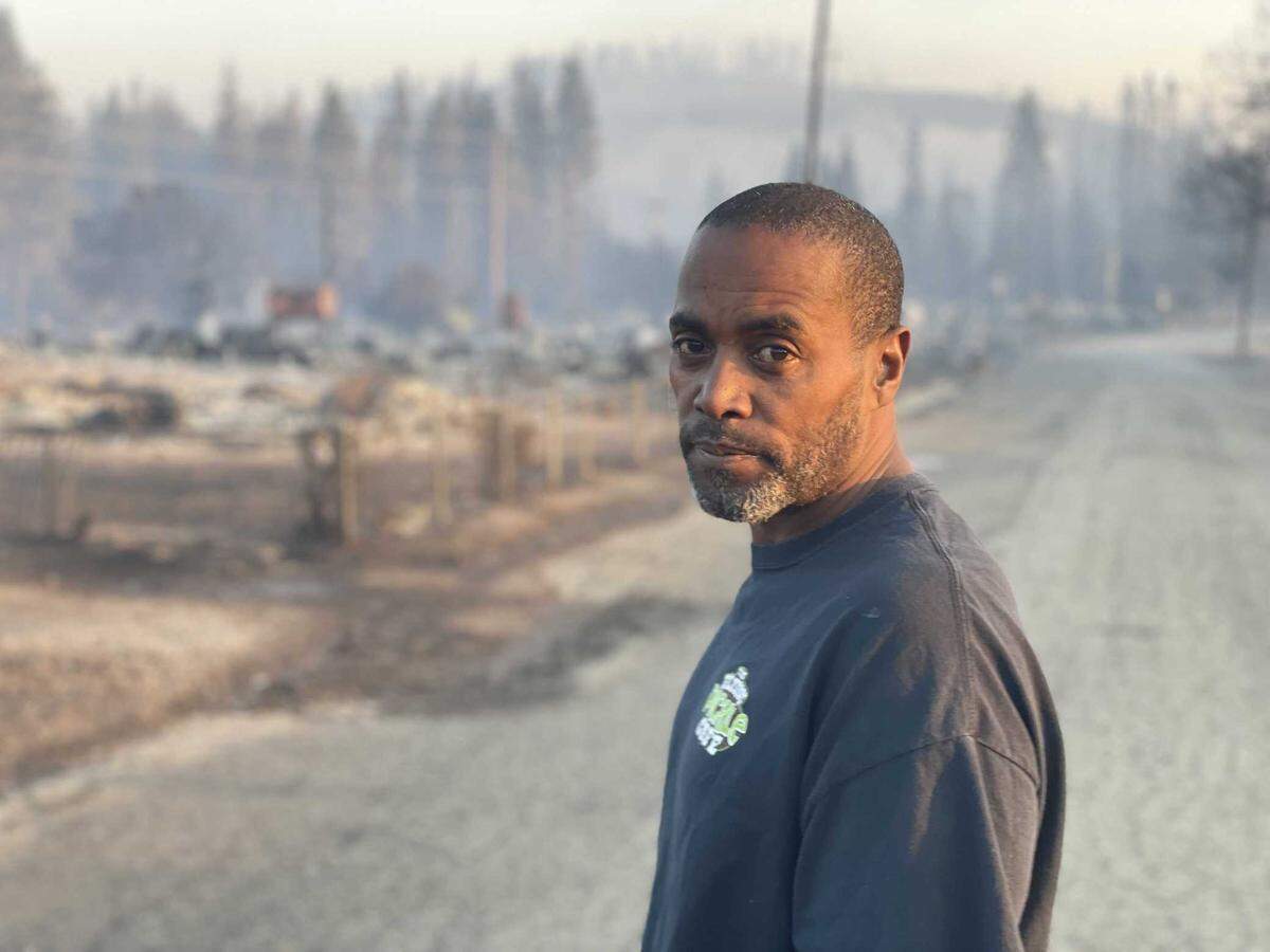 Daudi Etter stands near his Lincoln Heights home in was destroyed in 2022 by the Mill Fire, which tore through the historically Black neighborhood in Weed the day before.