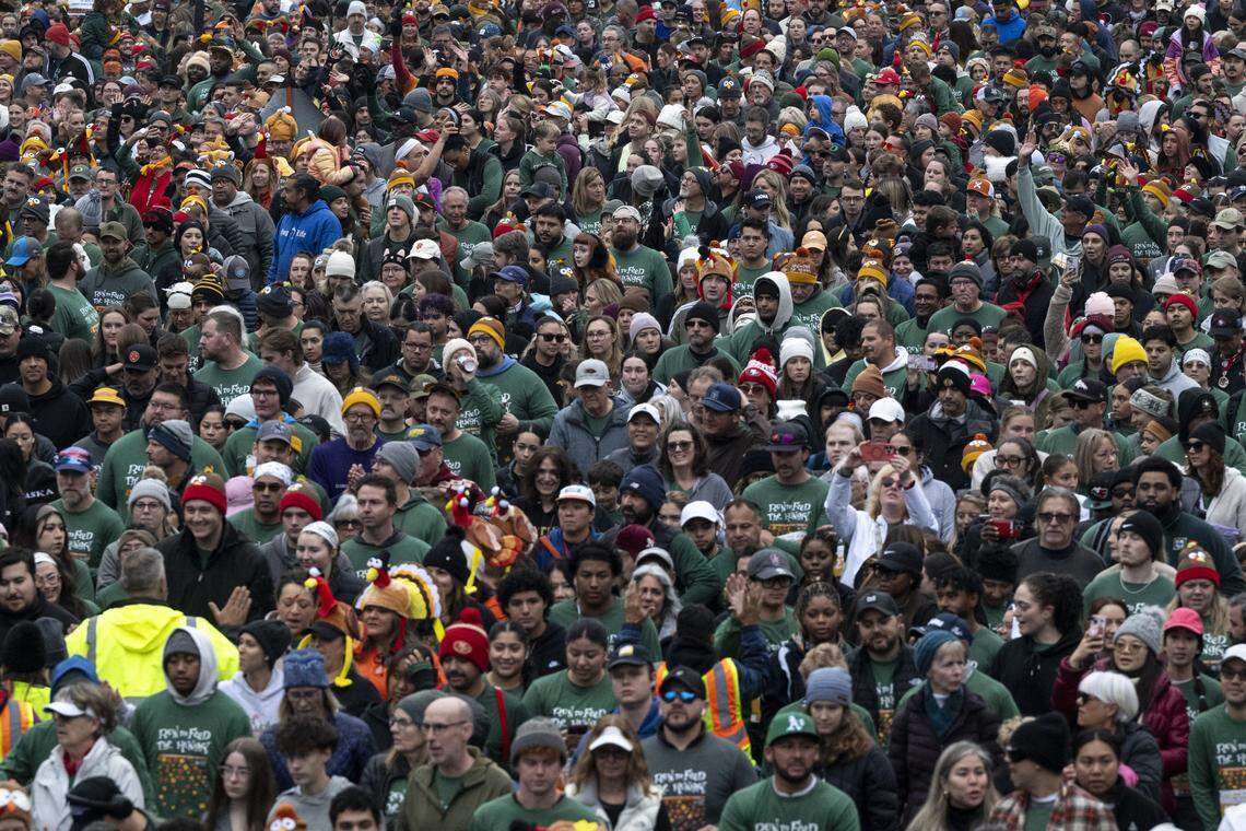 A crowd of runners before the start of the 5k race during the Run to Feed the Hungry in Sacramento on Thursday, Nov. 27, 2025.