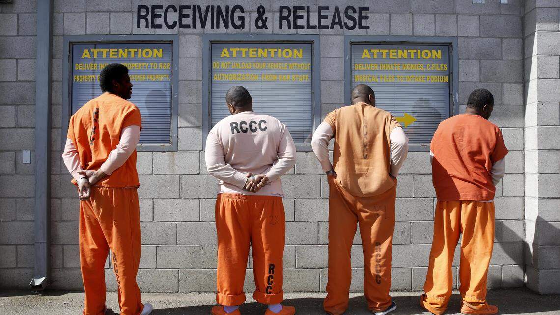 Prisoners from Sacramento County await processing after arriving at the Deuel Vocational Institution in Tracy.