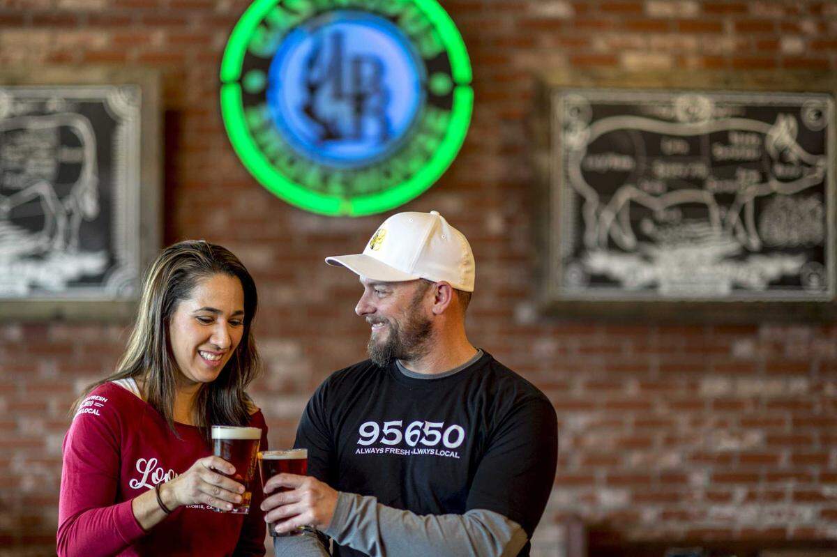 Kenny Gowan, right, founded Loomis Basin Brewing and opened the LBB Gastropub Smokehouse in Loomis in 2017. Here he shares a brew with his wife, Linda.