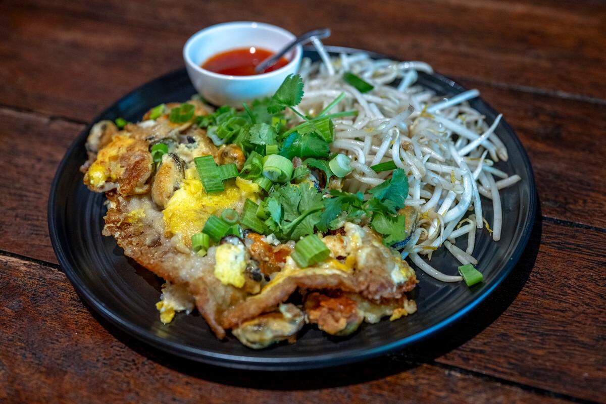 Hoy Tod, a mussel egg pancake, sits on a plate in Kin Thai Street Eatery.
