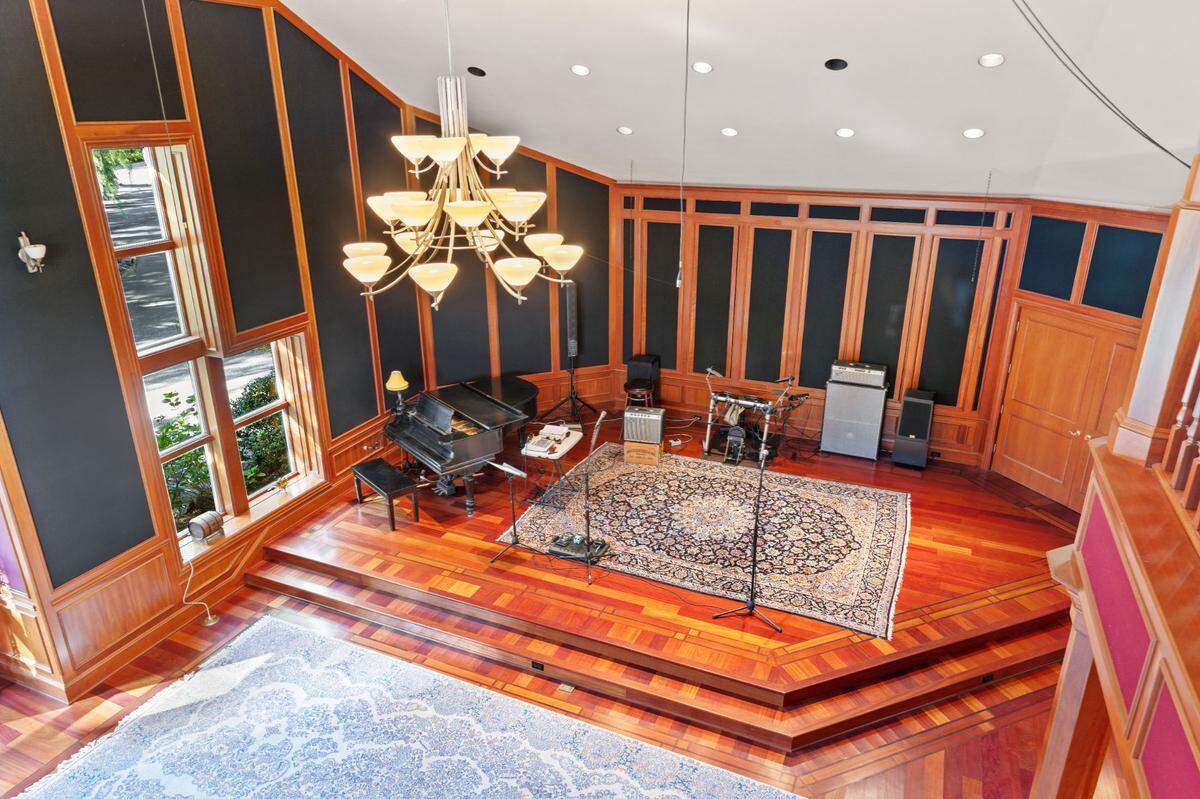 Cherry wood and a raised stage is part of the concert hall in the Nevada City home.