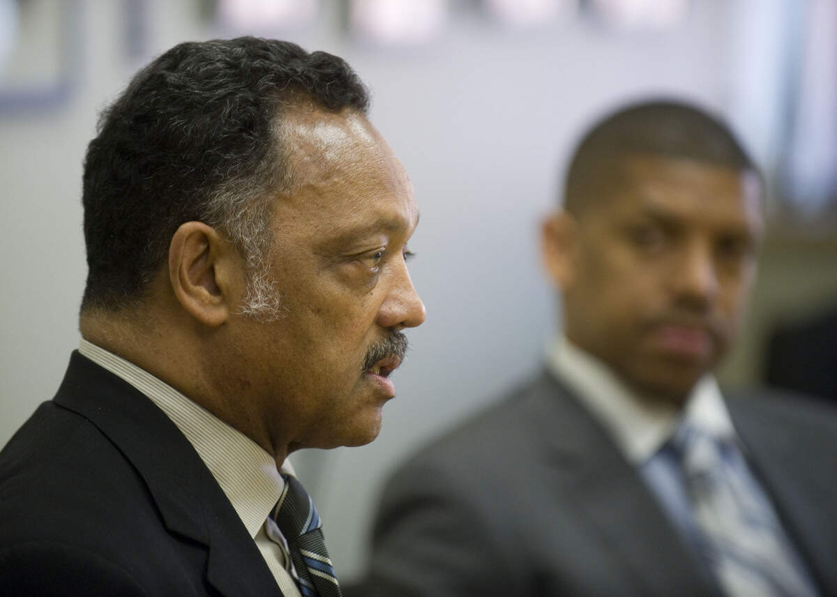 The Rev. Jesse Jackson answers questions during a meeting with The Sacramento Bee editorial board on March 2, 2009, as Sacramento Mayor Kevin Johnson listens in the background.