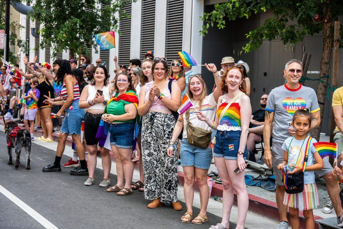 A group of spectators cheer for participants at the Sacramento Pride March on Sunday.