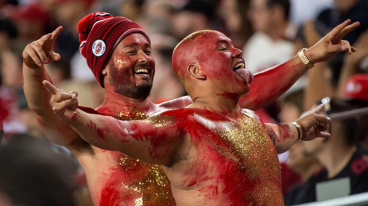 Painted in the San Francisco 49ers team colors, fans cheer during a game at the Levi’s Stadium on Monday, November 11, 2019 in Santa Clara.