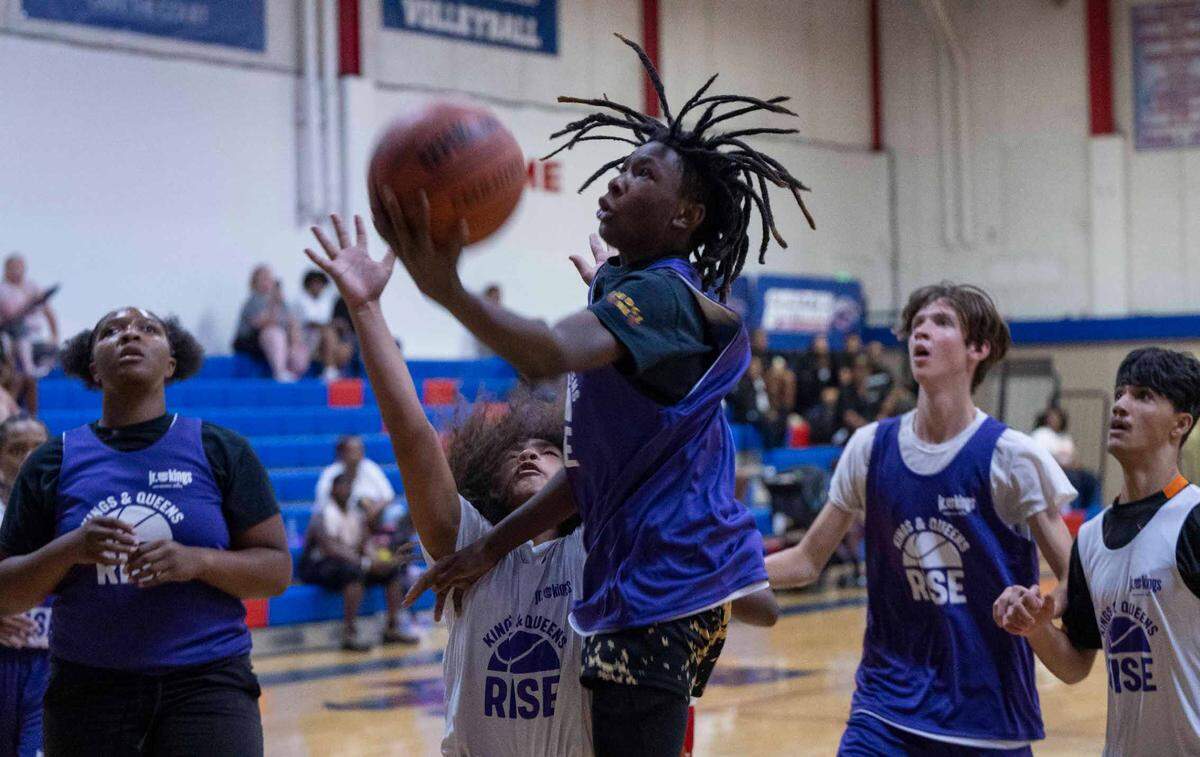 Tristin Murry goes up for a basket while playing a game on July 8 in the Kings and Queens Rise program.