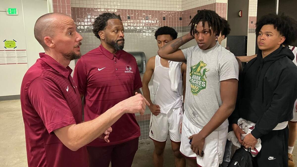Laguna Creek coaches Mike Gill, left, and Scott Silva, praised the defensive effort that led to a 65-53 Metro League victory over storied Grant.