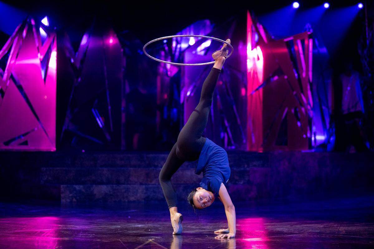 Hula hoops artist Yan Joan Zhuang rehearses for the Cirque du Soleil production of Alegría at Sutter Health Park in West Sacramento on Wednesday, July 27, 2022.