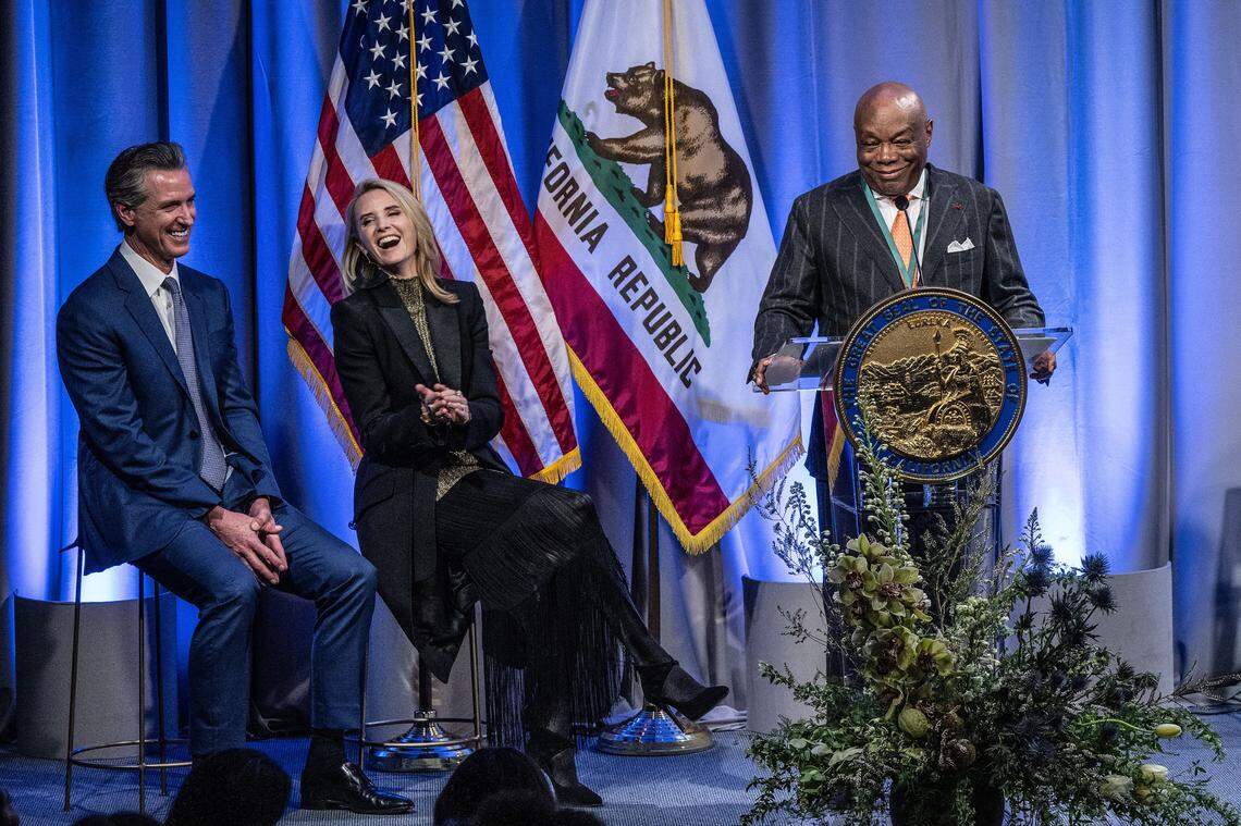Willie L. Brown Jr., former California Assembly Speaker who also served as mayor of San Francisco, speaks after being inducted into the California Hall of Fame on Tuesday, Feb. 6, 2024, at the California Museum in Sacramento. Gov. Gavin Newsom and First Partner Jennifer Siebel Newsom laugh at Brown’s comments. 