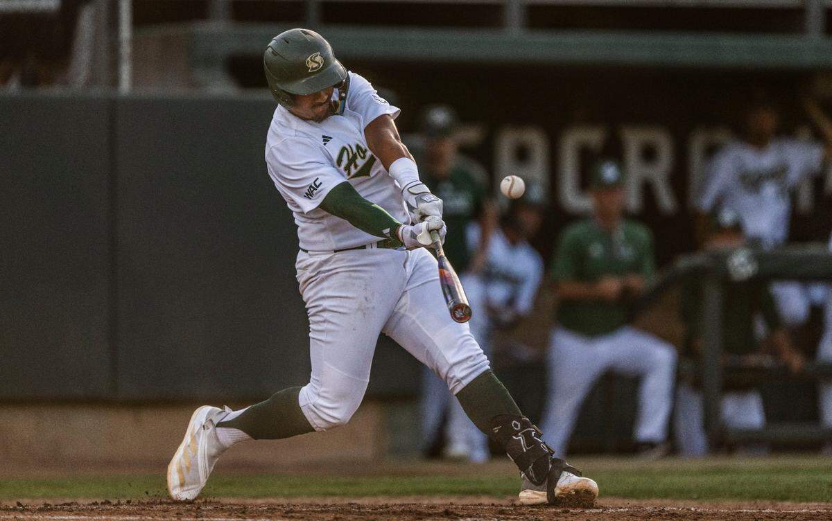 Sacramento State first baseman JP Smith (5) hits a three-run homer in the third inning during an NCAA baseball game against against the Utah Tech on Thursday at Sacramento State.