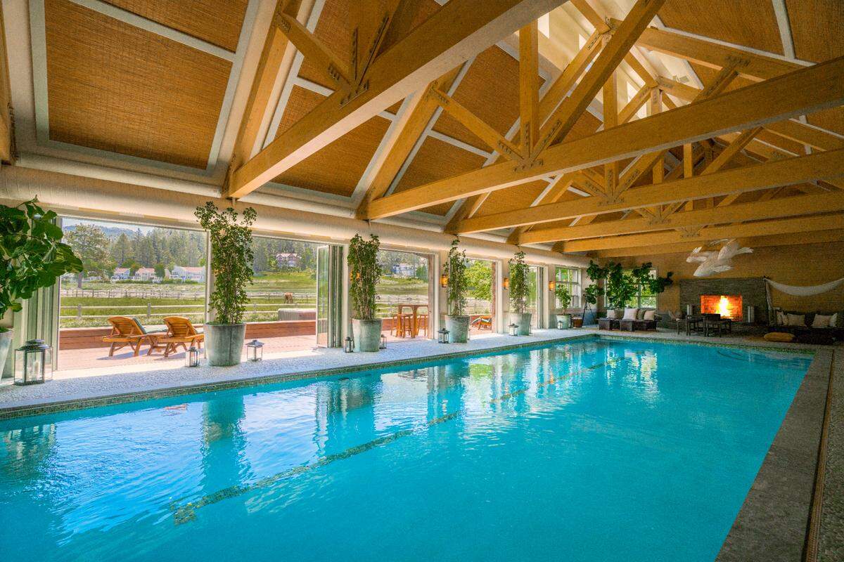 A grand pool house with an indoor pool is part of the Shakespeare Ranch offering in Lake Tahoe.
