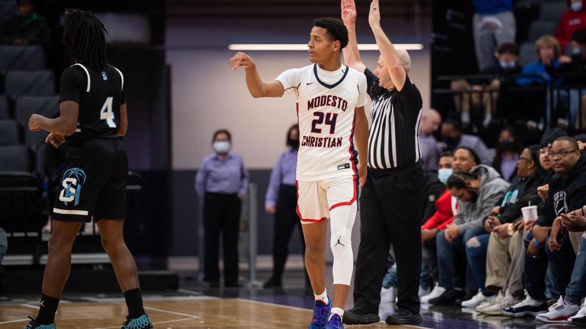 Modesto Christian Crusaders’ Jamari Phillips (24) calmly celebrates a three point basket during the fourth period against Sheldon at the high school boys basketball Sac-Joaquin Section Division I championship game Saturday, Feb. 26, 2022, at Golden 1 Center in Sacramento. Modesto Christian beat Sheldon, 52-42, for the title.
