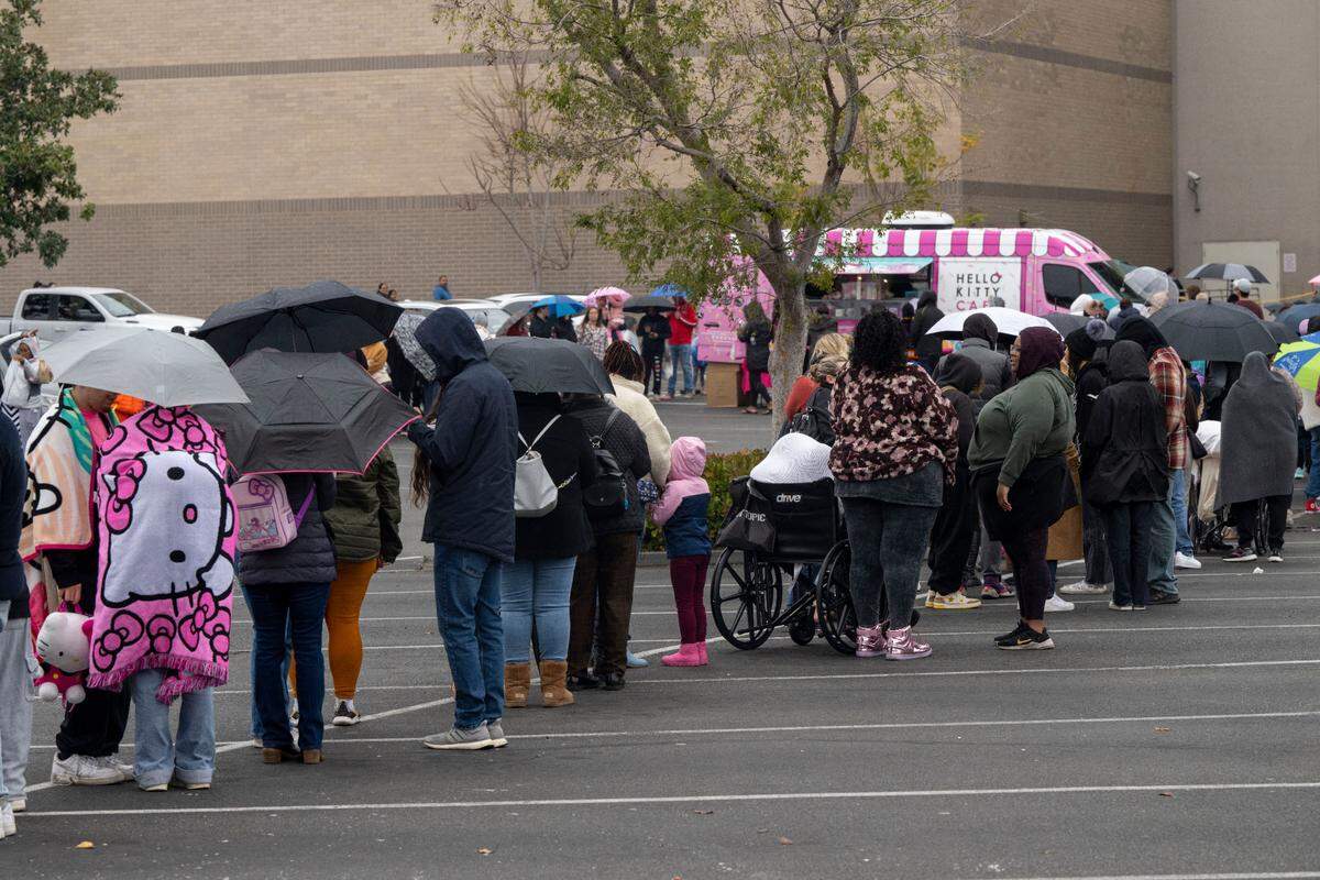 A long line of customers line up to buy things at the Hello Kitty Cafe Truck parked at Arden Fair mall in Sacramento on Jan. 6, 2024.