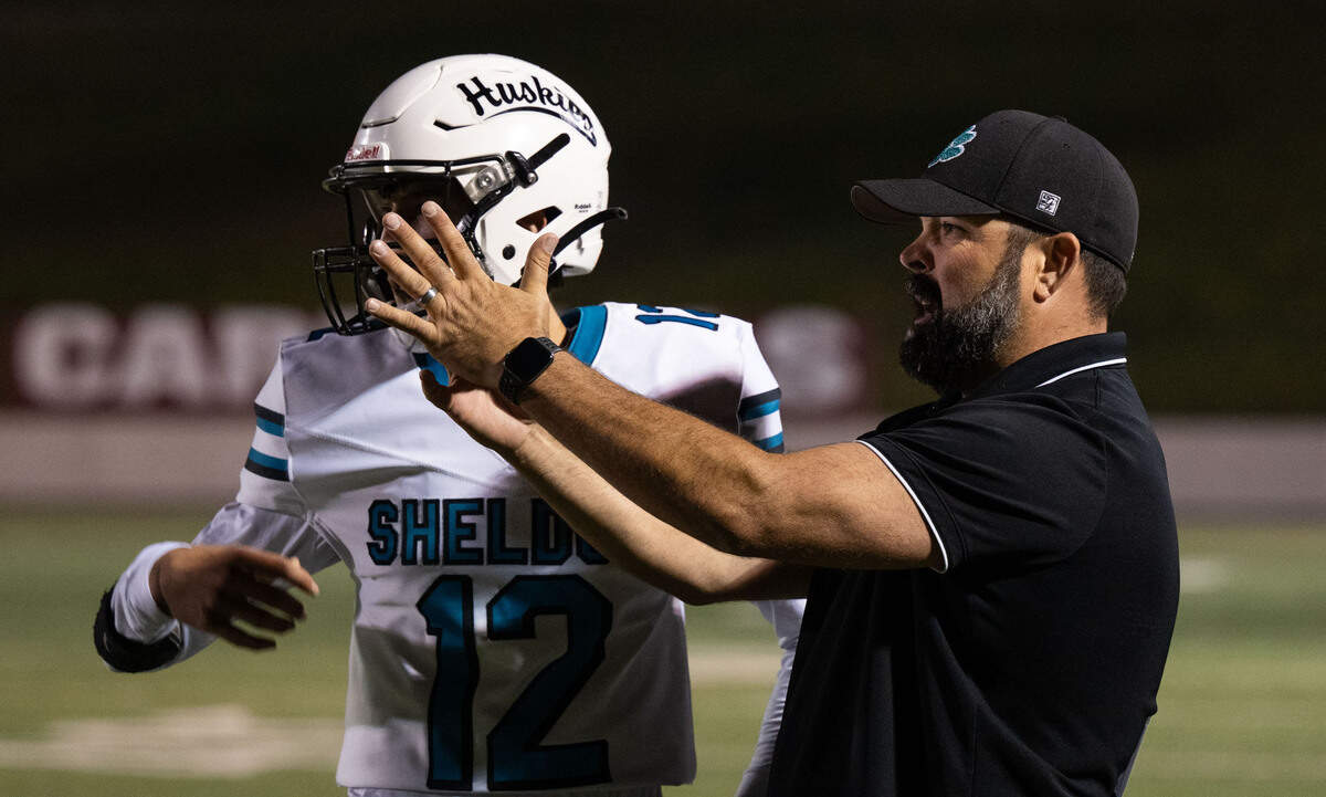 Sheldon High School Athletic Director Jason Bumbaca calls a timeout as he coaches the Huskies in the first half against Laguna Creek on Friday, at Cosumnes River College.