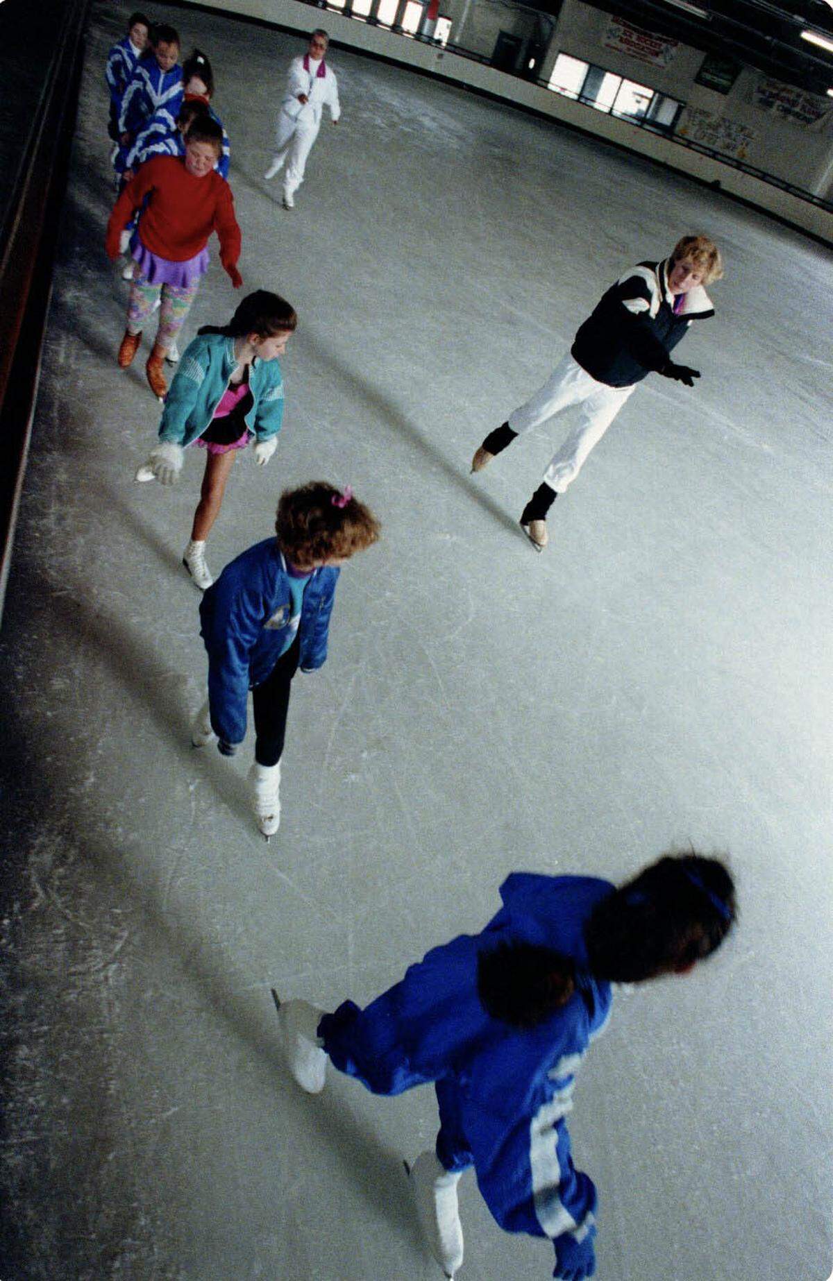 Coach Jayne Throckmorton, right, starts a practice for the Sacramento Ice Crystals skate club in 1992 at the Iceland rink in North Sacramento. The 13-member group, inspired by Kristi Yamaguchi's quest for Olympic gold, competed against precision skate teams across the West Coast. 