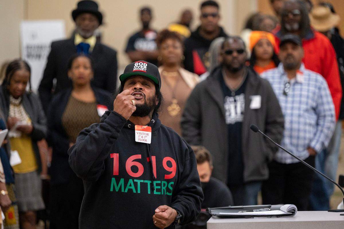 Reggie Roman, of Los Angeles, speaks during the public comment portion of the Reparations Task Force meeting at the CalEPA Building in Sacramento in March.