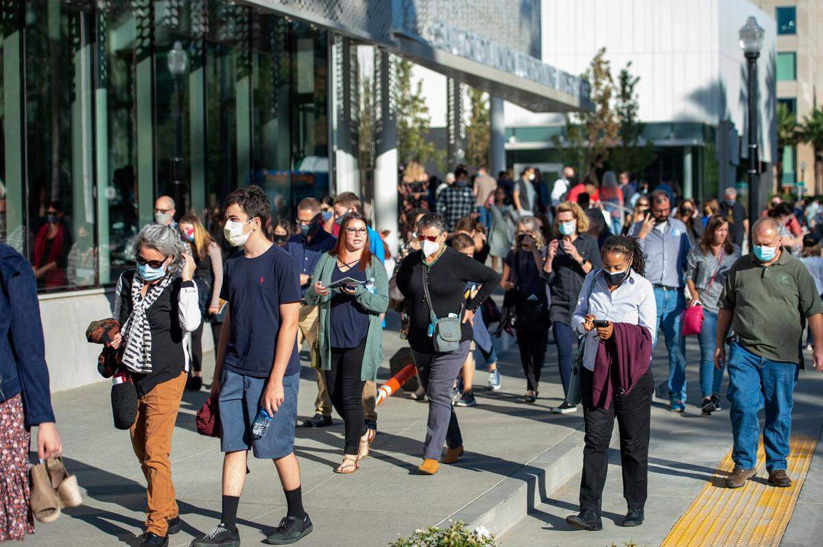 Theater goers spill onto L Street after the final showing of Hamilton at the Safe Credit Union Convention Center in downtown Sacramento on Sunday.