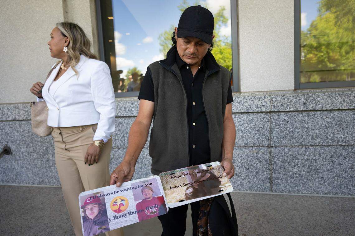 Jhony Ramos Sr. holds a photo of his sons, Jesus Ramos, 18, and Jhony Ramos Jr., 22, outside Yolo County Superior Court in Woodland, on Monday, April 13, 2026, after watching proceedings ahead of the arraignment for Sam Machado, Douglas Tollefsen, Craig Allen Cutright, Jack Ying Lee and Tammy Kiku Machado. The defendants face seven counts of murder and other charges related to the Esparto fireworks explosion.