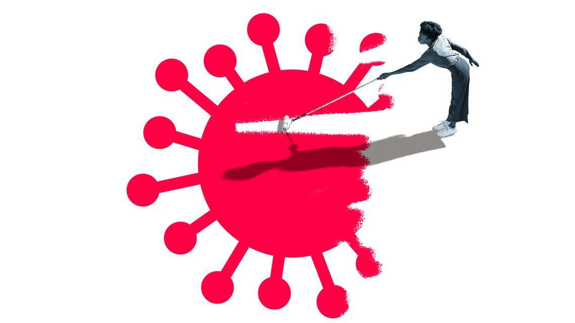 Woman paints over abstract drawing of COVID-19 virus