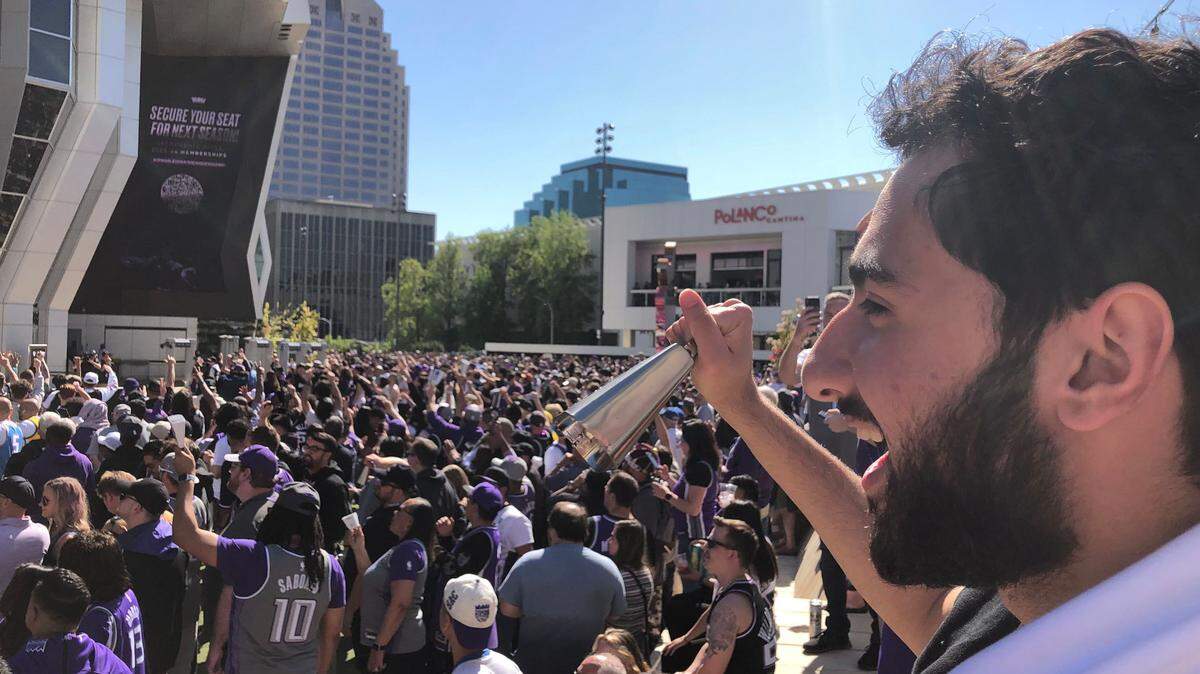 Zaid Alzanoon of Roseville rings his cowbell in front of Golden 1 Center before the Sacramento Kings play the Golden State Warriors in the first game of their NBA playoffs series on Saturday, April 15, 2023.