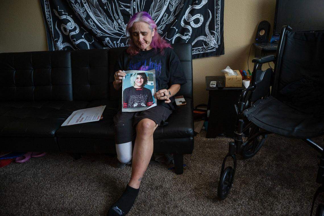 Marie Martinez holds on July 19, 2024, a picture of her son Shawn Jordan, 18, who died in June after he was hit by a car on Walerga Road in North Highlands. She dyes her hair purple, Shawn’s favorite color.