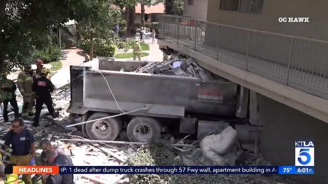 An out-of-control dump truck exiting an Anaheim, California, freeway crashed through an apartment building, killing one and injuring two, police say.