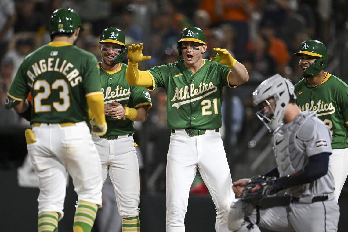 Athletics catcher Shea Langeliers (23) celebrates with his teammates after scoring a grand slam during a game against the Detroit Tigers at Sutter Health Park in Sacramento on Aug. 25.