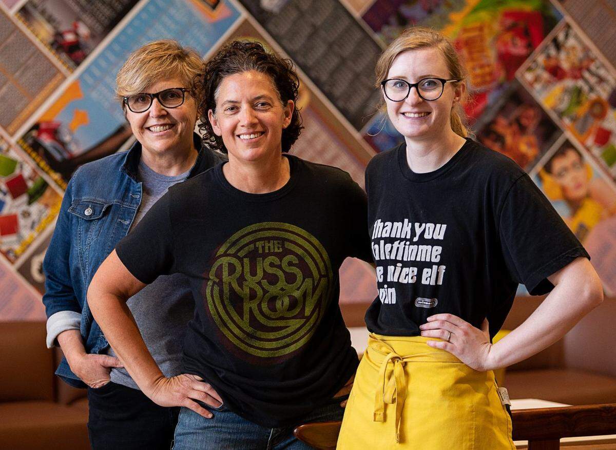 Owners Jami Goldstene and Andrea Lepore and lead baker Emily Mallari stand inside of the main dining room of Solomon’s Deli on K Street in Sacramento on Thursday, June 3, 2021.