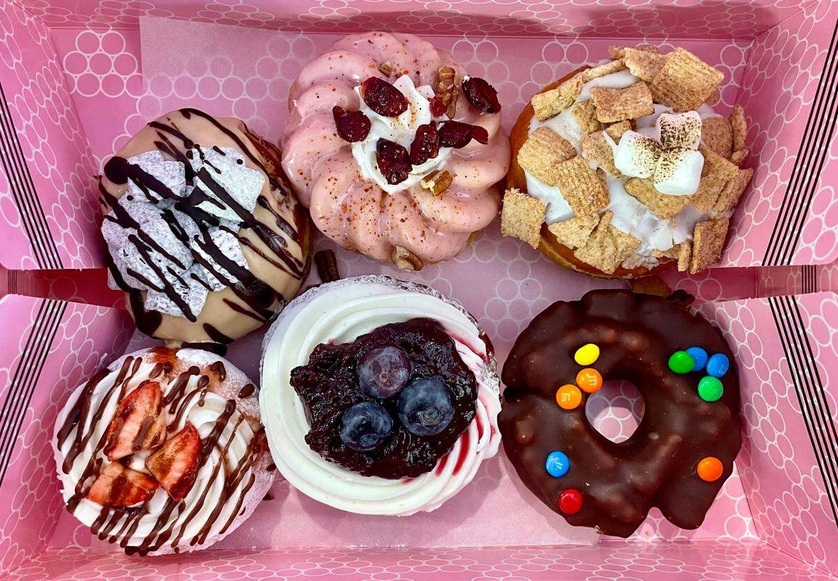 Bad Bakers’ doughnuts bear topping such as Cinnamon Toast Crunch, berry compote and mini M&Ms.