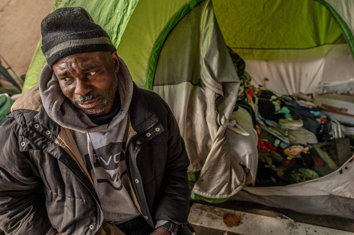 Tears stream down the face of Harold Carter, 52, as he talks in January about how his partner Karen Hunter, 57, who died during a severe storm a few days earlier, would have gone into a warming shelter in front of her tent at a homeless encampment under the overpass on 26th Street near W Street in Sacramento. “She would have went inside, and I know I would have went with her,” he said. “There would have been no exceptions – she would have made me go.”