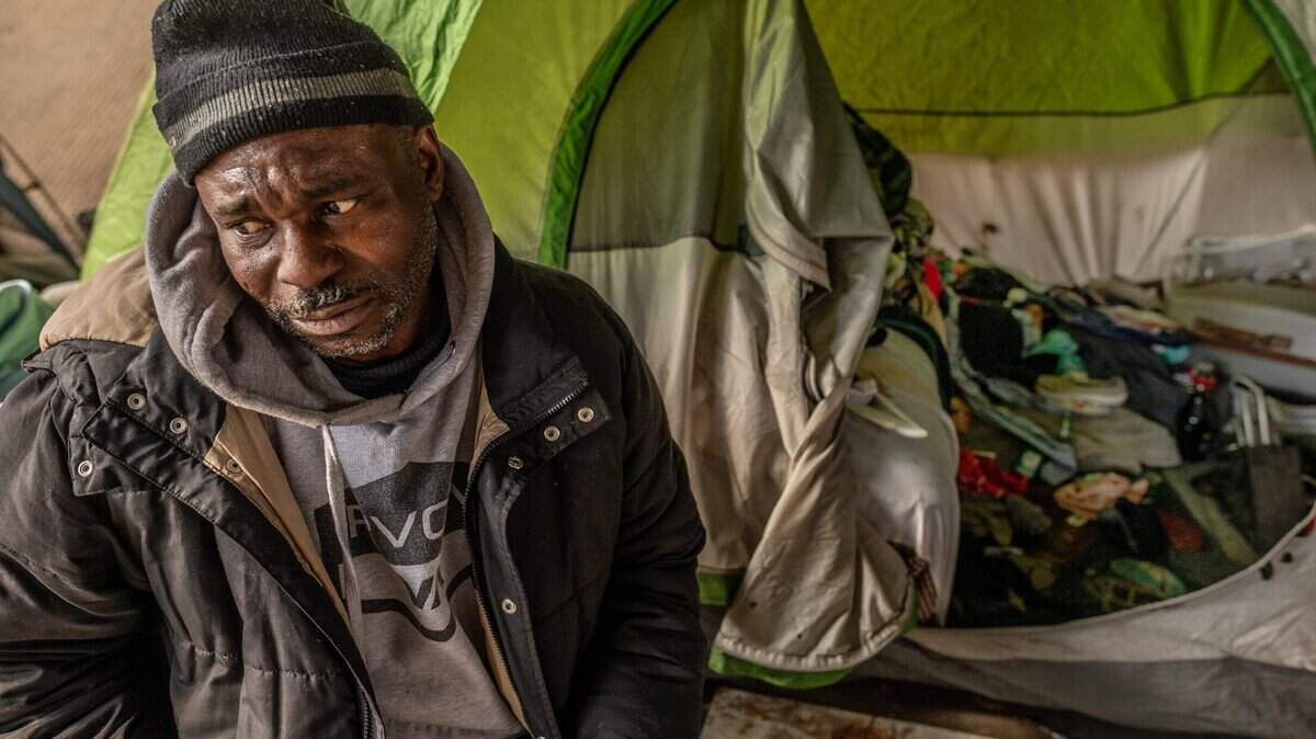 Tears stream down the face of Harold Carter, 52, as he talks on Friday, Jan. 29, 2021, about how his partner Karen Hunter, 57, who died during a severe storm on Tuesday night, would have gone into a warming shelter in front of her tent at a homeless encampment under the overpass on 26th Street near W Street in Sacramento. “She would have went inside, and I know I would have went with her,” he said. “There would have been no exceptions – she would have made me go.”