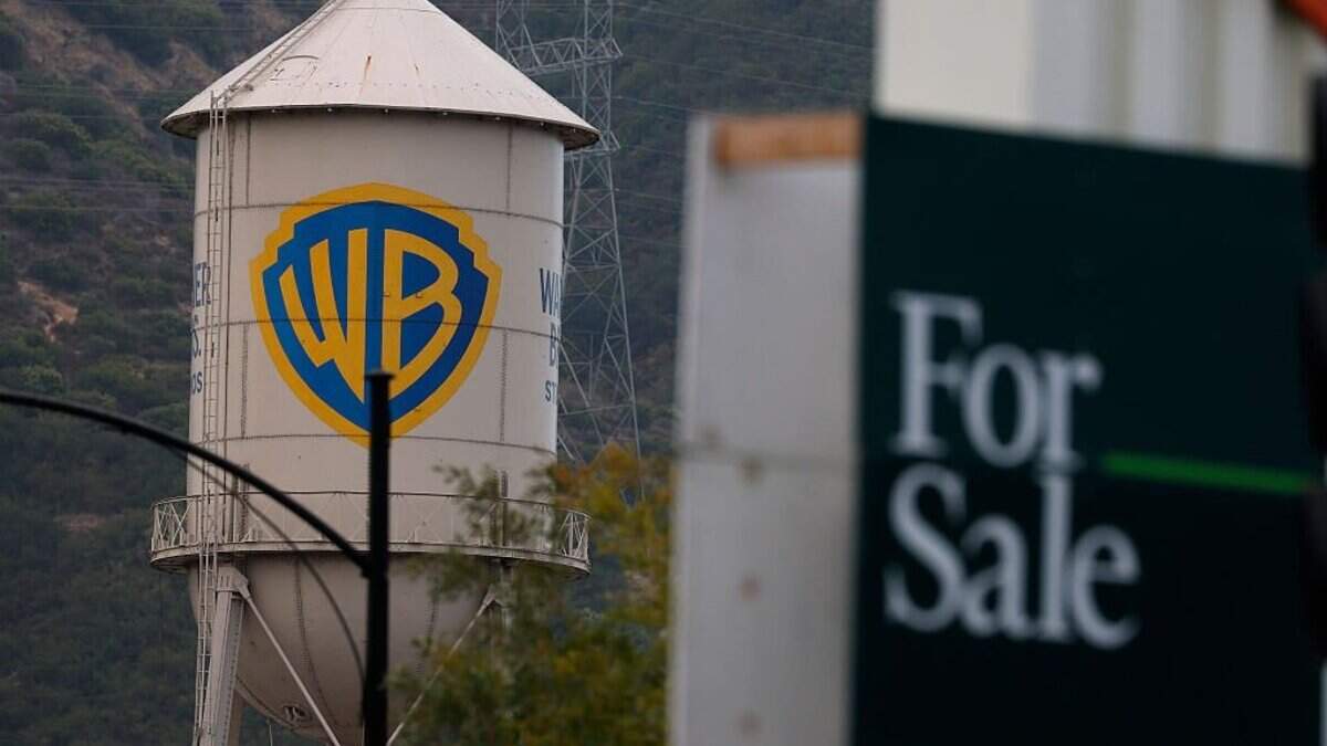 The Warner Bros. logo is displayed on the water tower at Warner Bros. Studio on July 13, 2026 in Burbank, California. A federal judge has temporarily halted the merger between Warner and Paramount following an antitrust lawsuit by a California-led coalition of attorneys general.