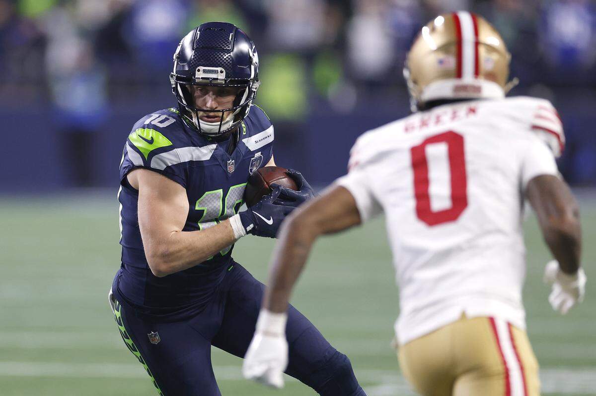 Cooper Kupp #10 of the Seattle Seahawks runs the ball after a catch against Renardo Green of the San Francisco 49ers during the first quarter of an NFC divisional round playoff game at Lumen Field on Jan. 17, 2026 in Seattle.
