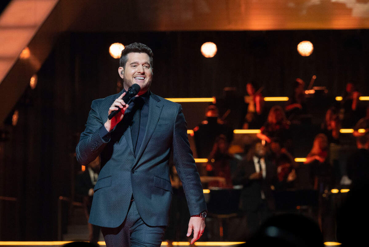 Michael Bublé walks down the stage while performing his Higher Tour at Golden 1 Center in Sacramento on Saturday. He is backed by a 36-piece orchestra.