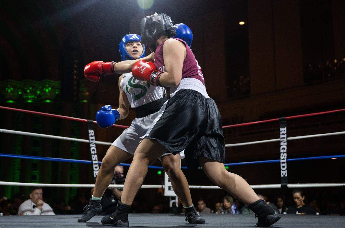 Ayahna Gonzales of Sacramento State hits Alondra Valdez of UC Santa Clara during the Causeway Boxing Classic at Memorial Auditorium on Friday.