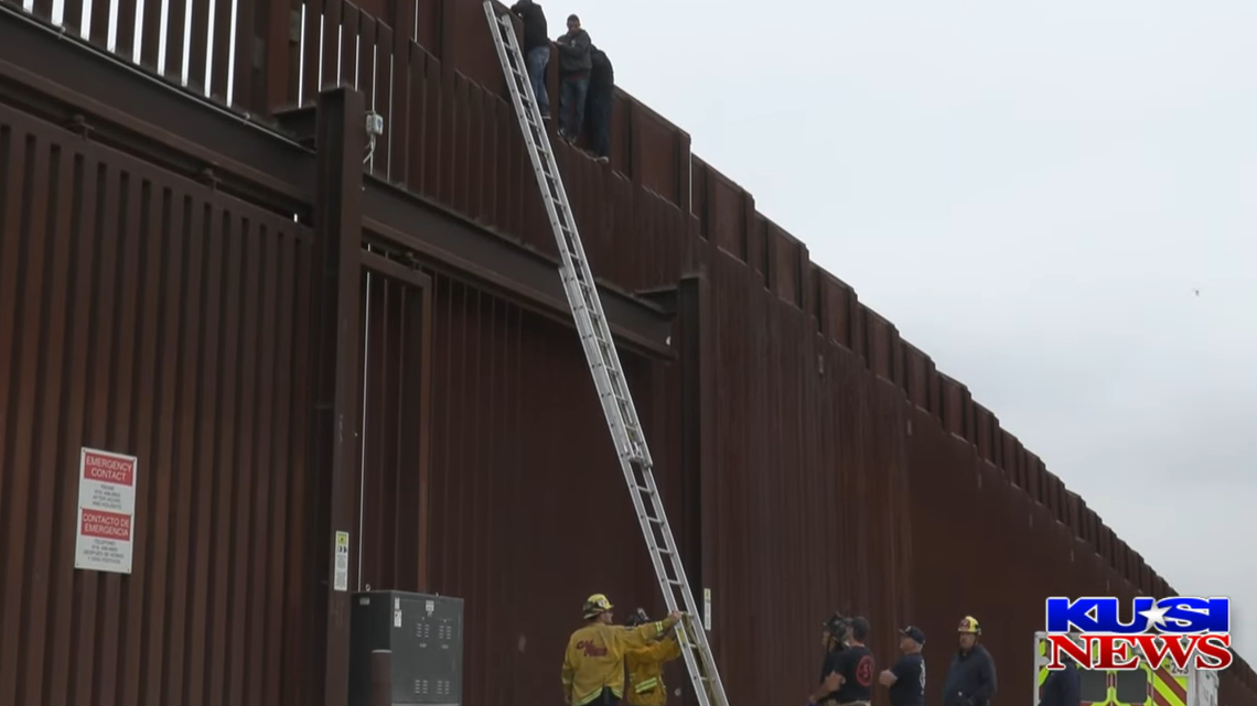 Three were rescued from the border wall, officials announced.