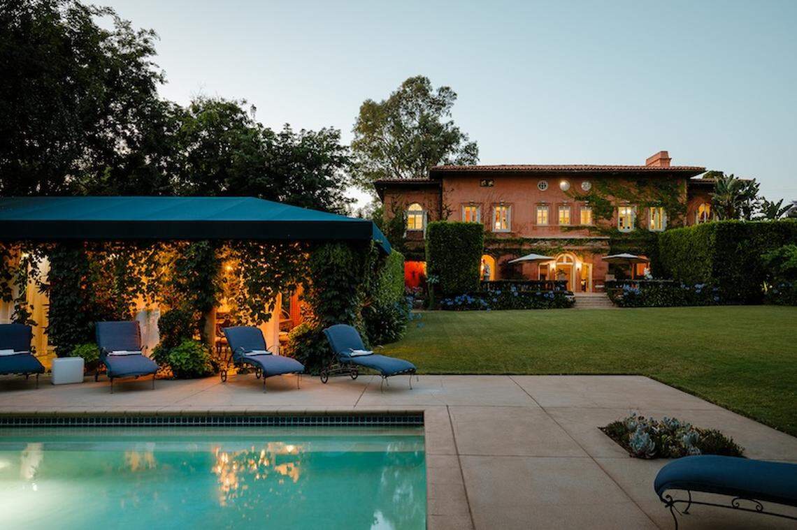 Revel in the inviting pool and spa area, complete with a cabana, al fresco dining, and a fireplace grill—ideal for gatherings or relaxing in your private oasis.