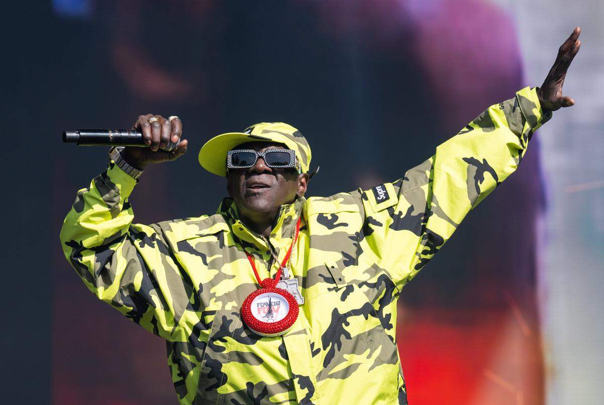 Rapper Flavor Flav performs with Public Enemy, still wearing a Flavor Flav kitchen timer necklace from a cooking demonstration earlier in the day, during the BottleRock music festival in Napa on Friday, May 23, 2025. 