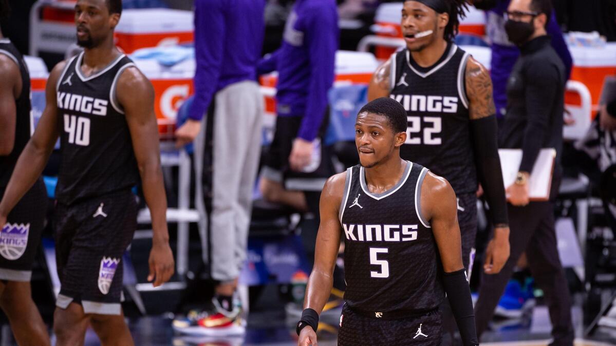 Sacramento Kings guard De’Aaron Fox (5), Harrison Barnes (40) and Richaun Holmes (22) wind down after their 119-111 loss to the Philadelphia 76ers at the NBA game Tuesday, Feb. 9, 2021, at Golden 1 Center in Sacramento. The 76ers beat the Kings 119-111.