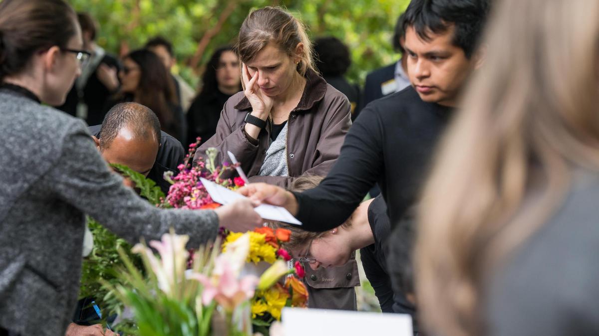 UC Davis students, staff and community members visit a table to write messages for the family before a Celebration of Life for Karim Abou Najm on Friday, May 5, 2023, at the UC Davis International Center on campus. Najm, a UC Davis senior and son of a professor, was fatally stabbed in Sycamore Park in Davis.