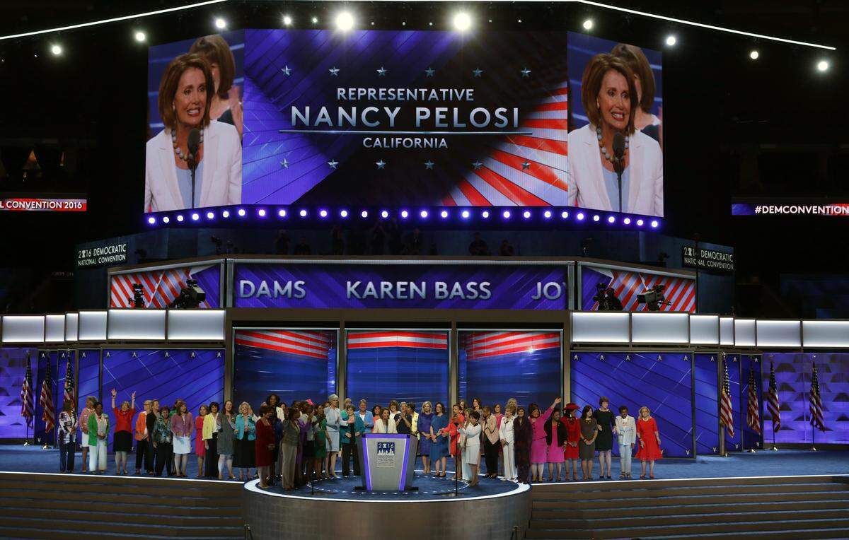 House Minority Leader Nancy Pelosi, D-Calif., speaks as Democratic women members of the House of Representatives wave to the crowd on the second day of the Democratic National Convention at the Wells Fargo Center, July 26, 2016 in Philadelphia. The party hopes to elect Democratic presidential candidate Hillary Clinton as the nation’s first female president. 