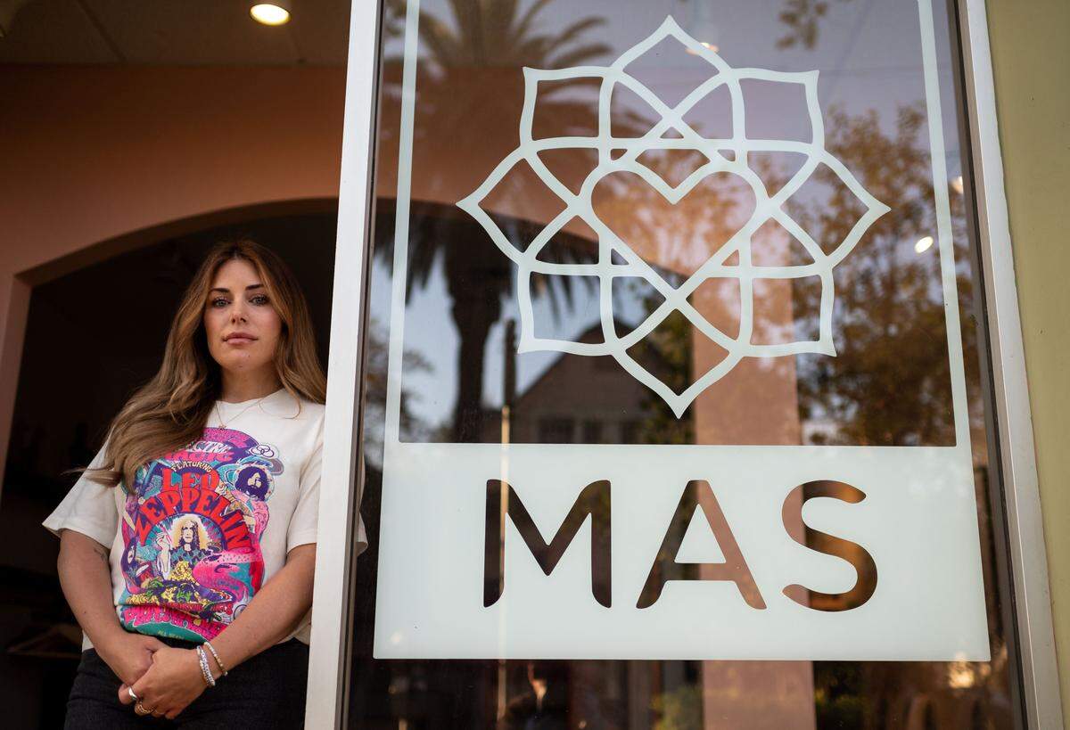 Mas Amor beauty salon owner Kayci Subia stands in front of a darkened room that she previously used to house a boutique in her business at 2231 J St. in midtown.
