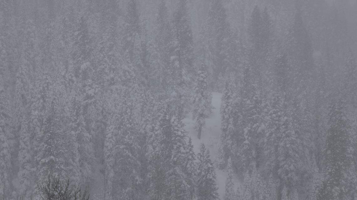 Helicopter above deadly Sierra avalanche scene as crews wait to recover victims
