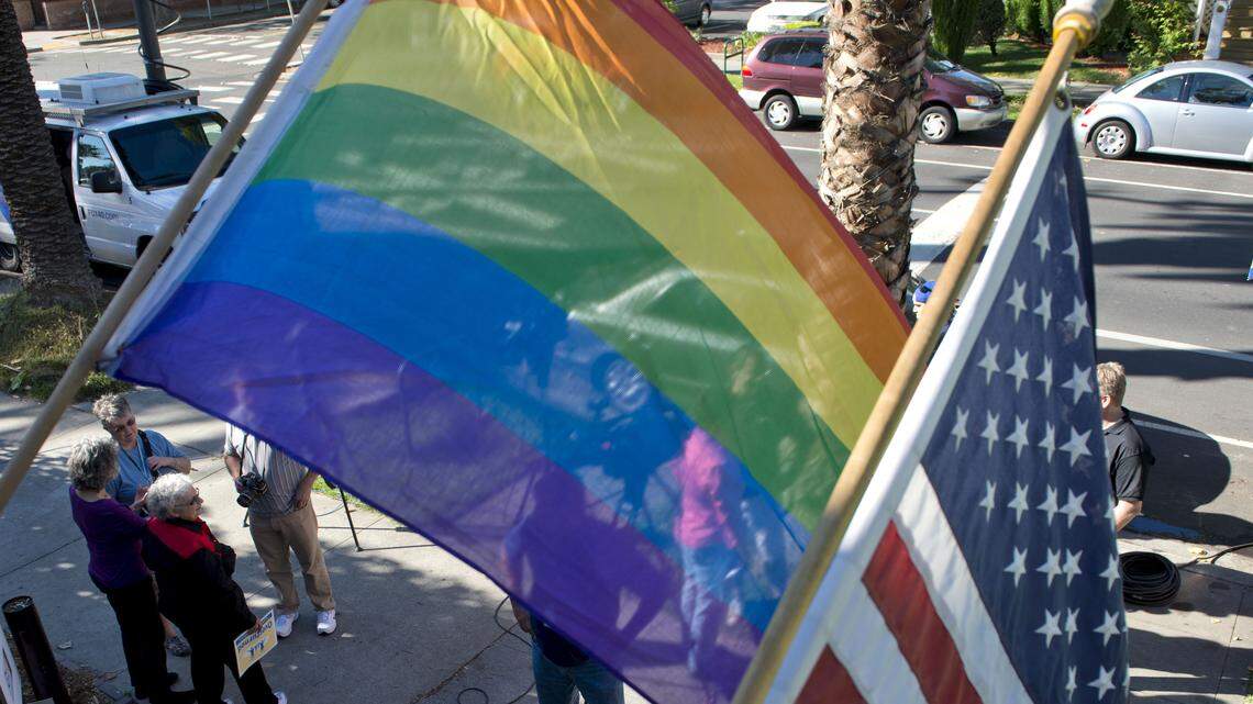 A pride flag and the American flag hang over the Sacramento LGBT Community Center in midtown Sacramento.