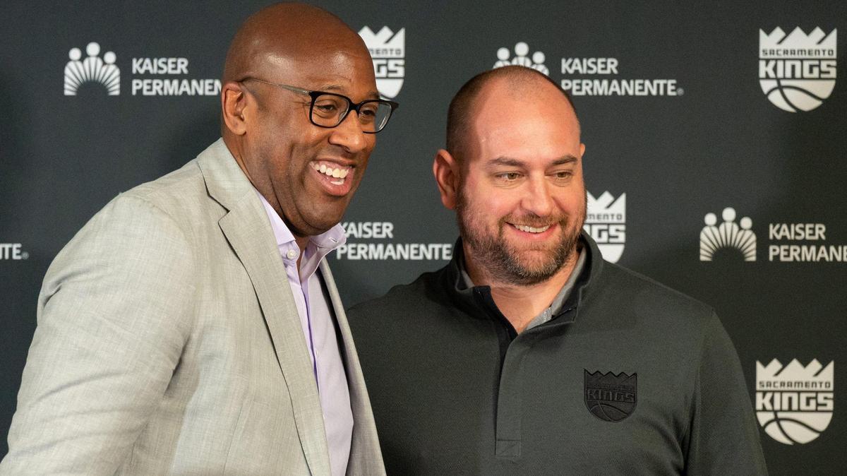 Sacramento Kings general manager Monte McNair, right, stands with Mike Brown after the Kings coach was introduced to the media at a press conference at Golden 1 Center in June.